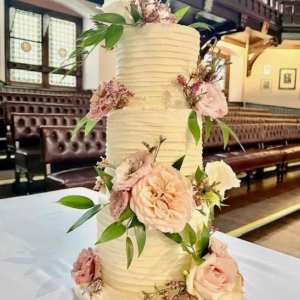 Buttercream ruffles & florist flowers wedding cake
